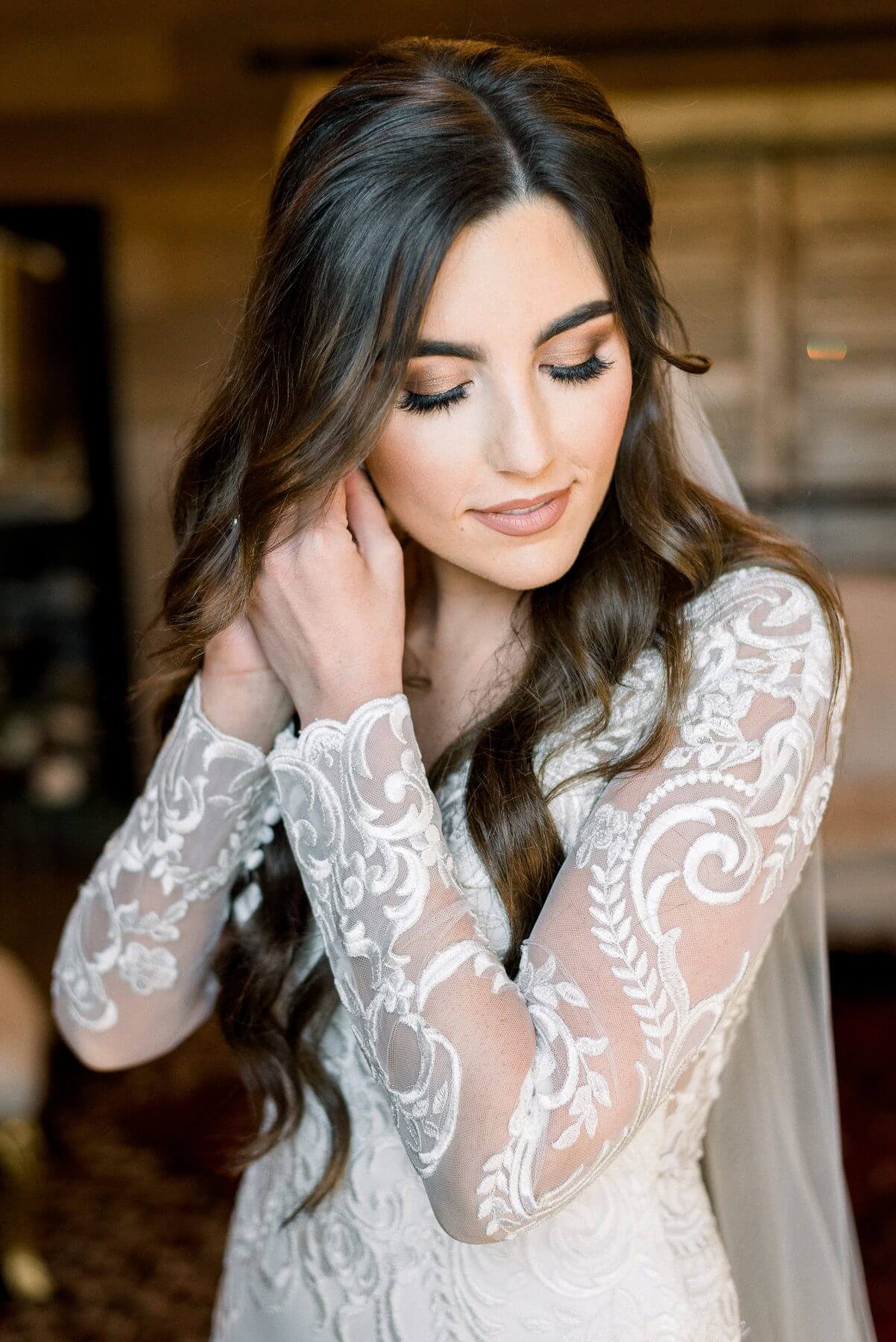 Ashley puts the finishing touches on her bridal look.