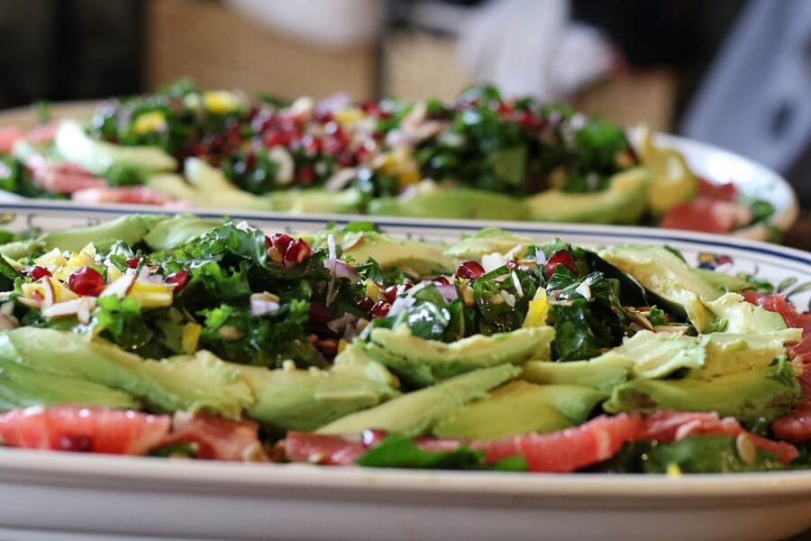 Two plates of collard greens salad.