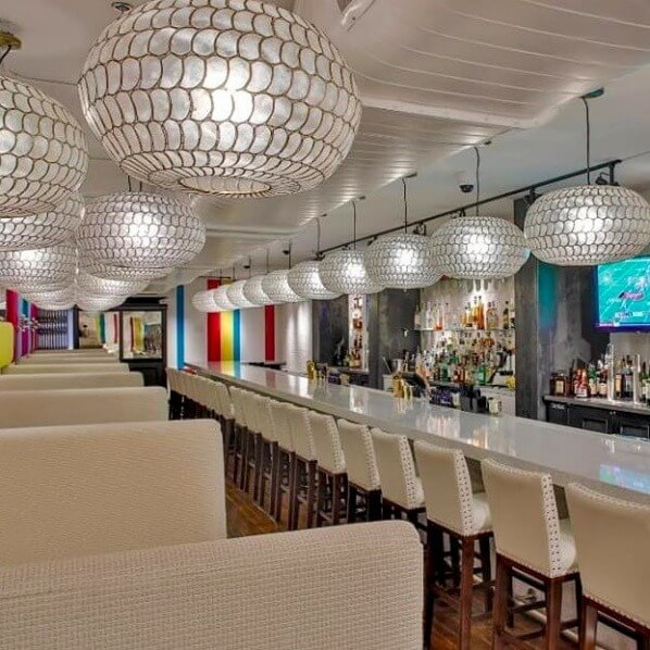 The interior of the Tailors’ Union features a sleek atmosphere and snazzy lighting, designed by Ann Nordeen Parker of Parker Design Studio.