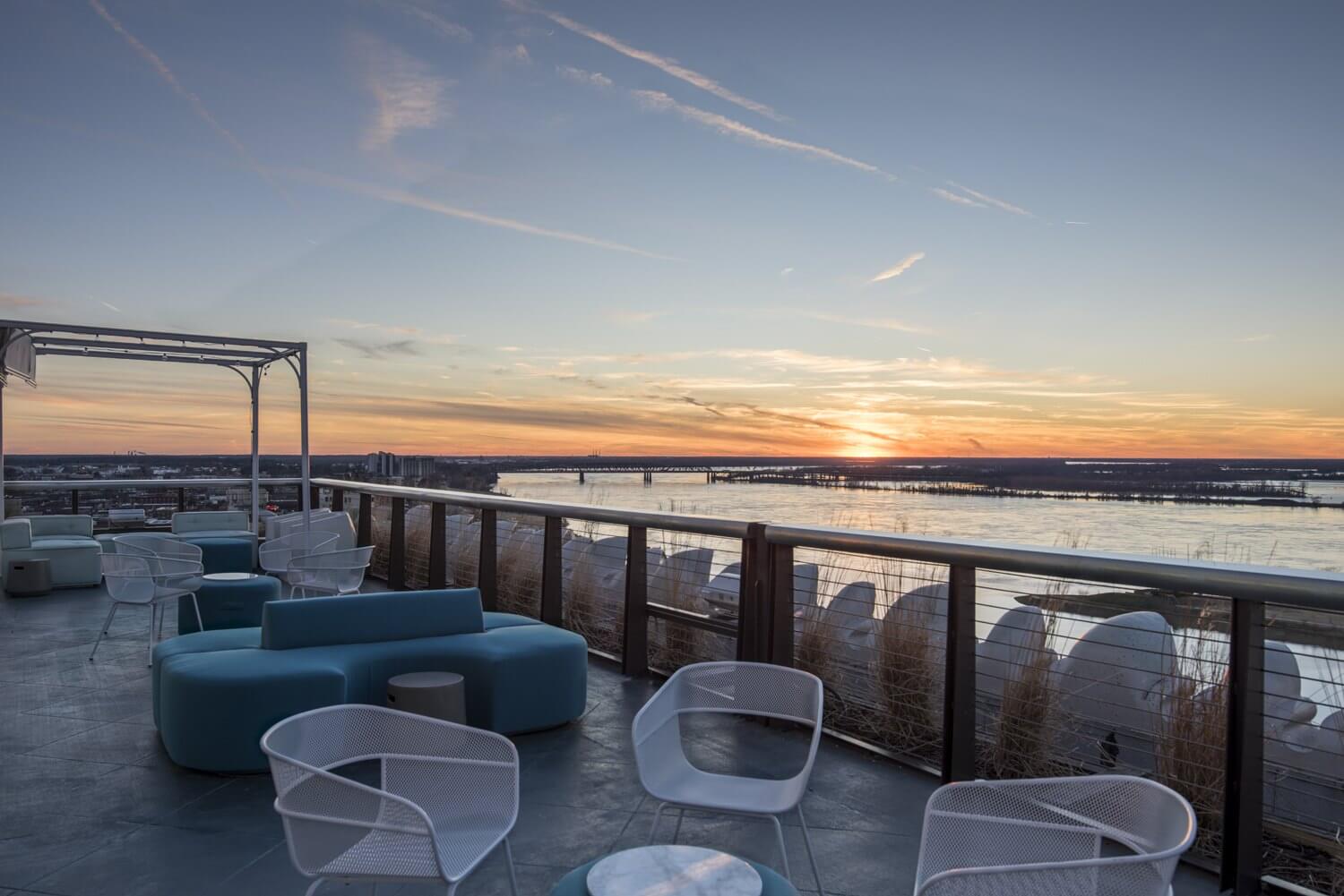 Minimalist, modern patio furniture sets the stage at Hu. Roof, allowing the stunning view to do the rest of the work. Image: Hu. Hotel