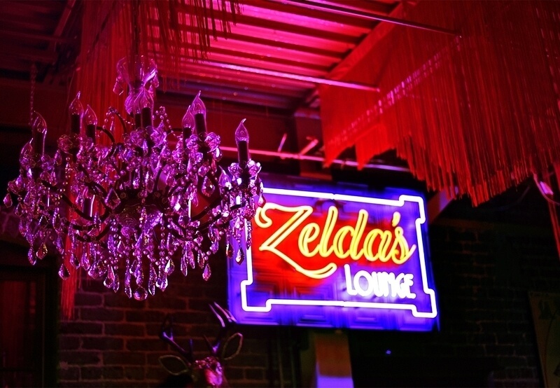 Zelda's Lounge sign and chandelier.