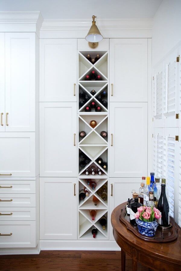 A floor-to-ceiling built-in wine cabinet makes the most of every last inch of space. wine storage