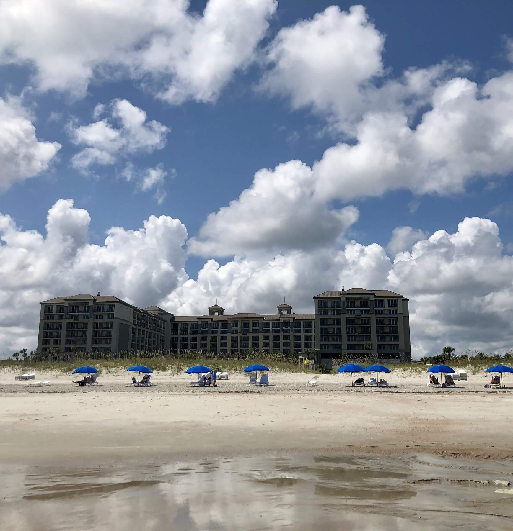 The beachfront Ritz-Carlton Amelia Island is surrounded by natural dunes and miles of quiet beaches, and there’s always those iconic blue umbrellas to provide a little shade. Image: Lisa Mowry The Ritz-Carlton Amelia Island beachfront
