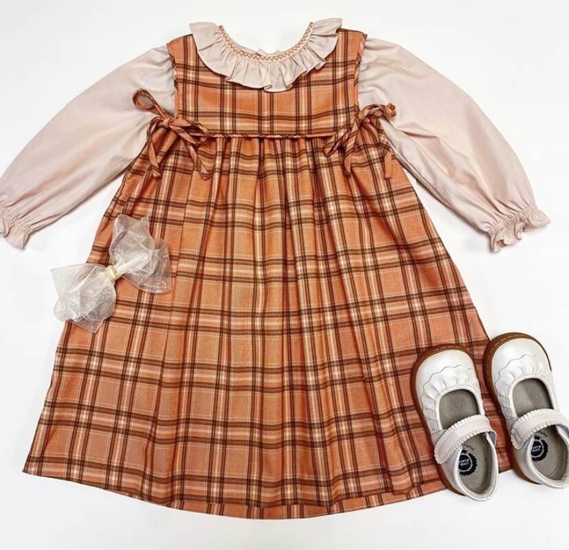 Plaid dress, $66; Shoes, $74; Bow, $8, at Cotton Tails September FINDS Memphis: plaid dress at Cotton Tails