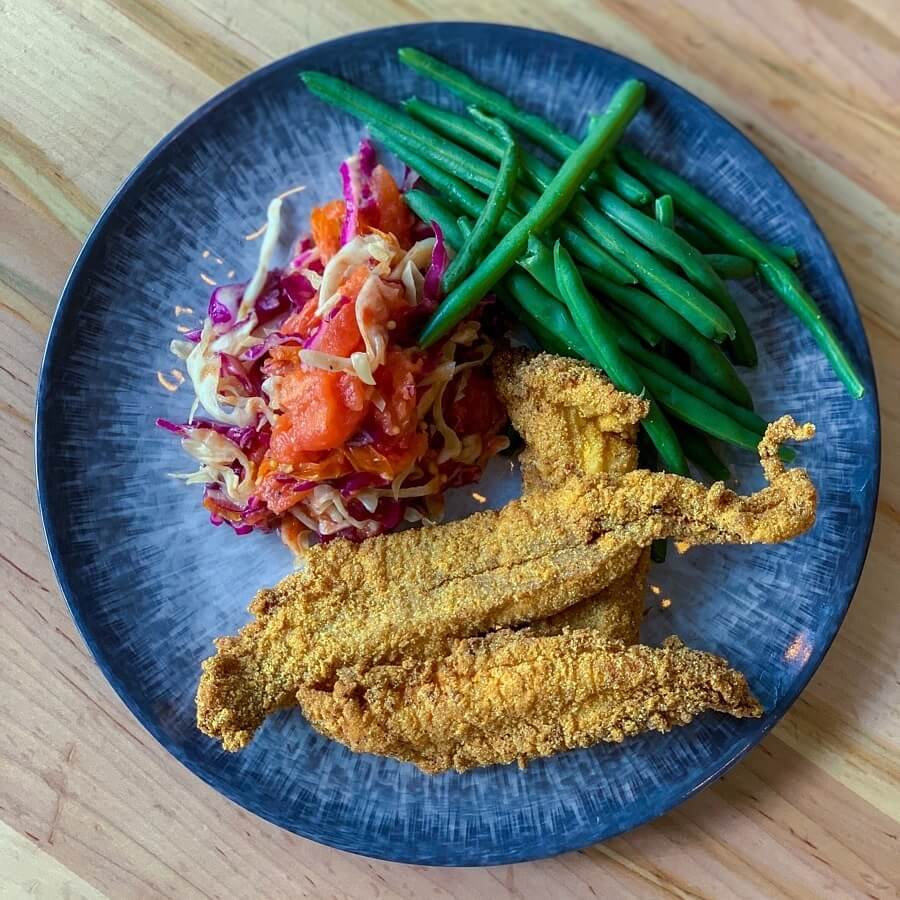 These fried pieces of crispy goodness are catfish fillets. All the sides come from local farms. Image: Across the Board Restaurant Group 3rd & Court catfish fillets
