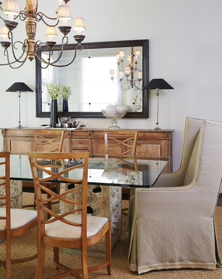 Wood, stone, glass and seagrass are accented by modern lines in this chic dining space. dining room