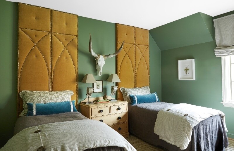 A longhorn skull lends an edgy vibe to this color-forward guest room. guest room- Melanie Pounds