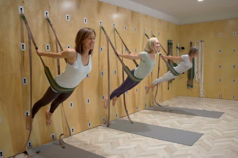 Yoga Wall classes help students find more ease and versatility in hundreds of yoga asana poses. Image: Nicole Rossi Yoga Wall Class- Practice Works