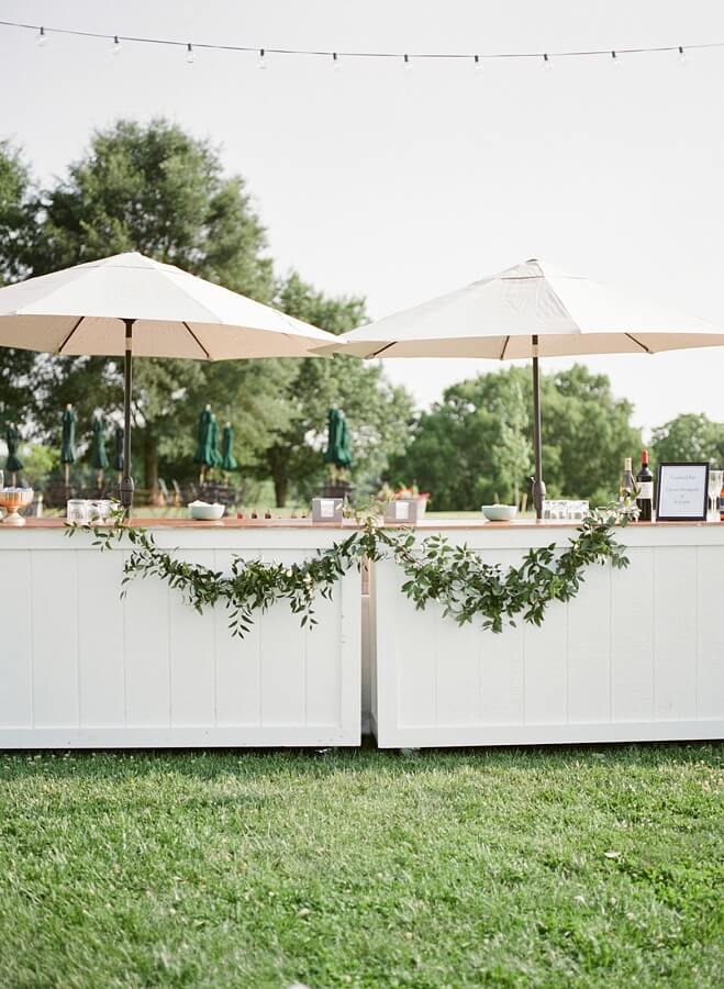 This outdoor cocktail hour set up is stunning. outdoor cocktail bar at Charlottesville winery wedding wedding