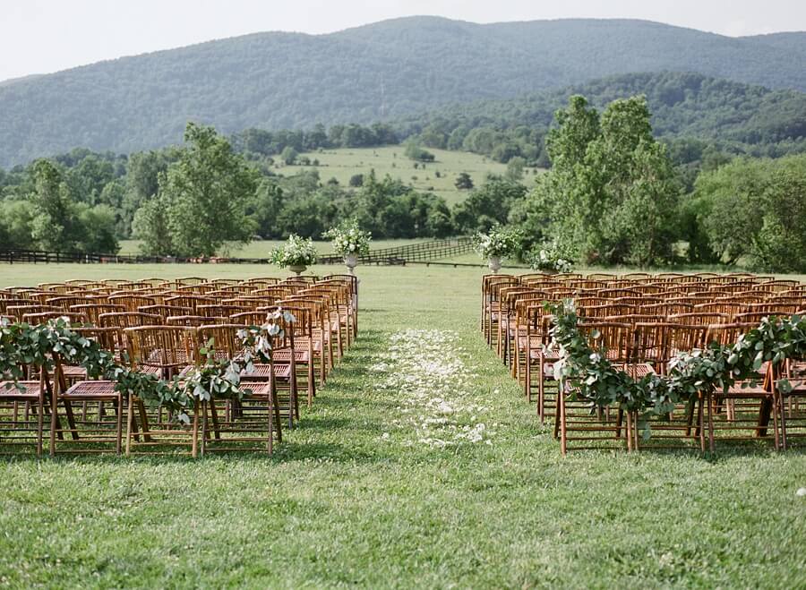 "We had the BEST wedding planner! Cody, owner of Amore Events in Charlottesville helped us every step of the way," Lauren says. Ceremony set up at Charlottesville winery wedding