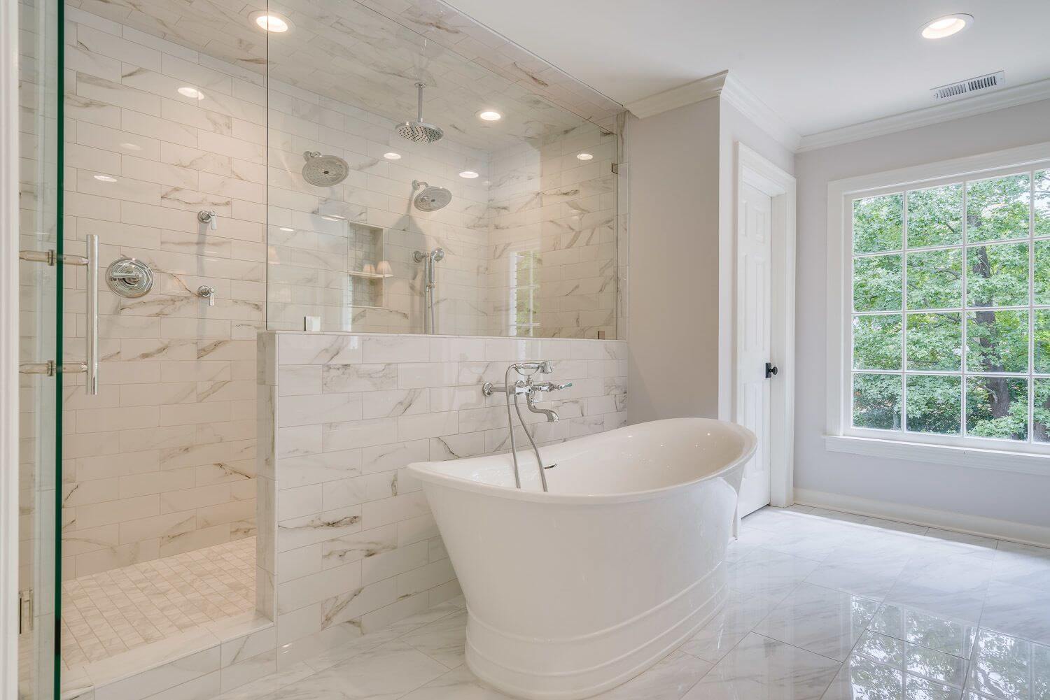AFTER: Wow is the first word that comes to mind when seeing this master bathroom. In the shower, we can’t help but call out the tiled ceiling. This is something E.J. does in all of his showers — “It makes it easier to clean,” he says. Master bathroom by R. Co Construction