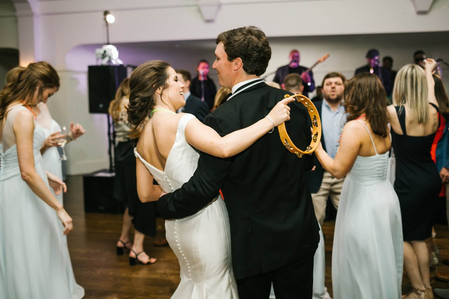 Kerry advises other brides-to-be to pause and take time to enjoy being engaged, and to be decisive in the wedding planning process. “That helped me a lot,” says Kerry. “Once I made a choice I didn’t go back and forth on it. I had a pretty clear vision of what I wanted and what I liked.” bride and groom dancing