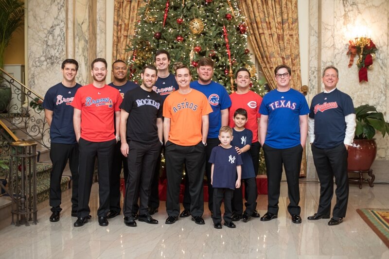 The guys chose a more sporty day-of look, representing their favorite teams. Groomsmen in team shirts