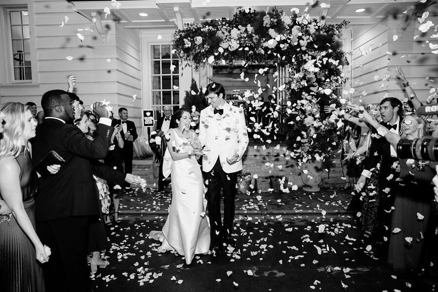 bride and groom departure with rose petals