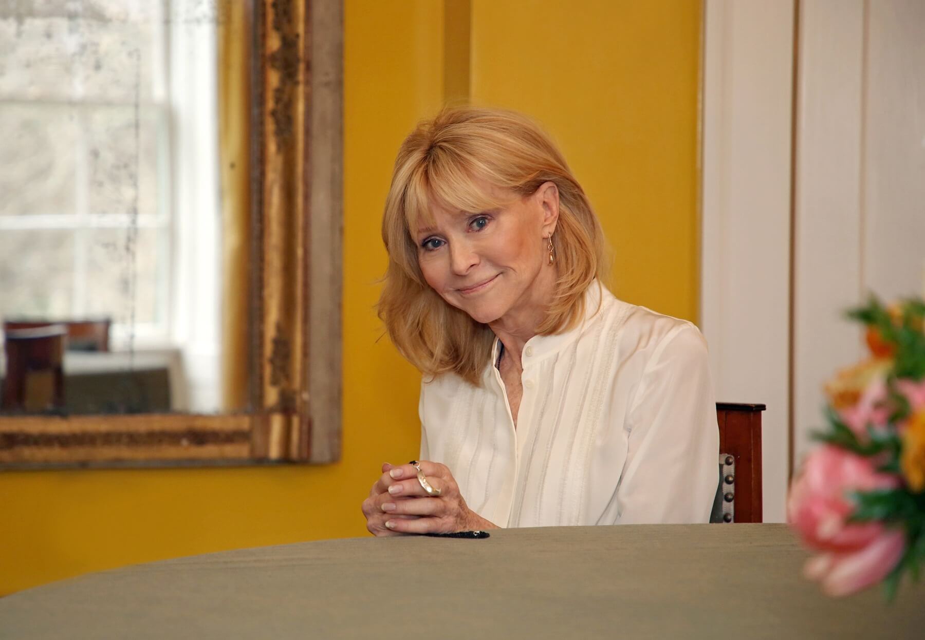 Helen sitting at a table