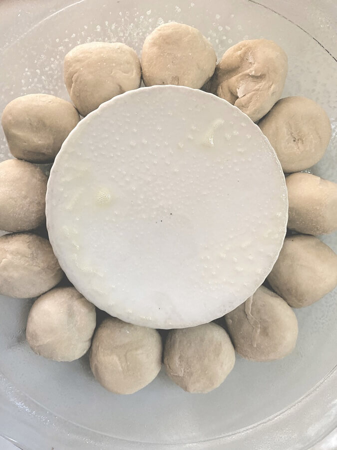 Prep the dinner rolls for the spinach and artichoke dip