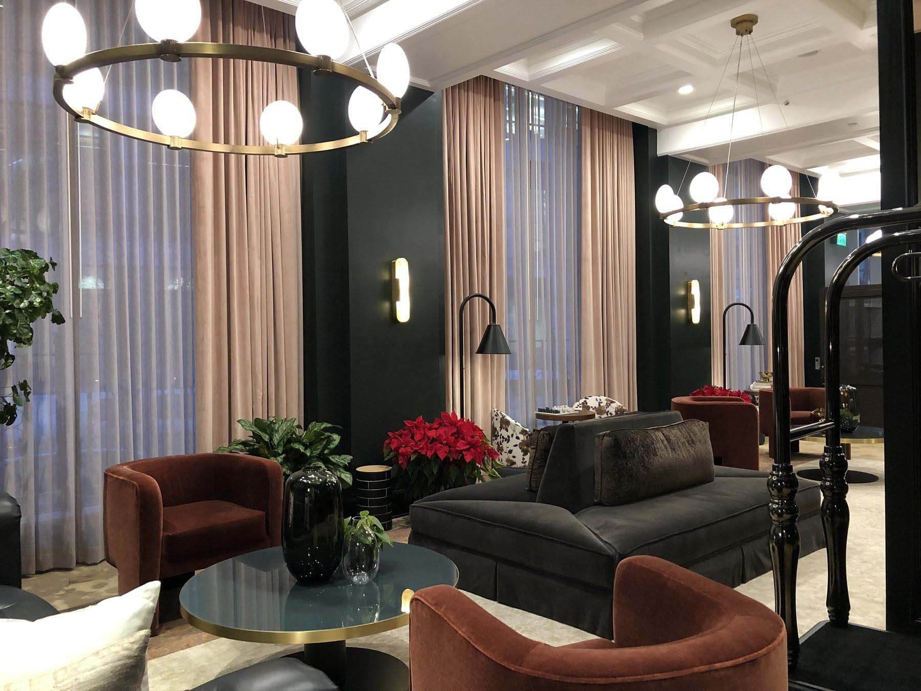 The Candler Hotel’s check-in desk and lobby boast luscious velvet fabrics, unique contemporary furniture and locally-sourced art. Image: Nicole Letts How to Spend a Weekend in Atlanta — stay at the candler