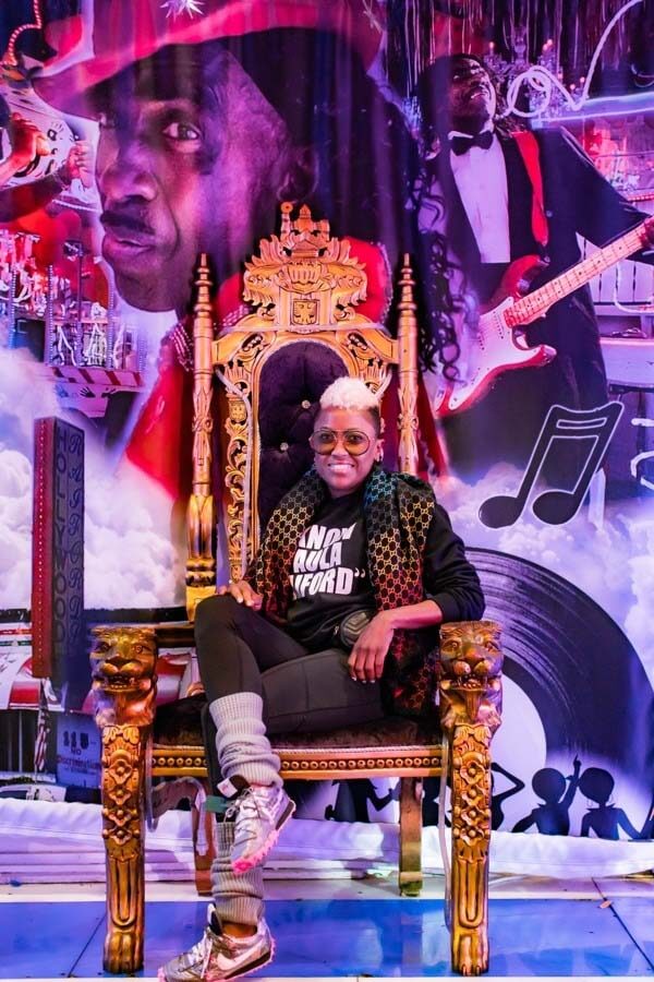 Paula Raiford sitting in royal chair in Paula & Raiford's