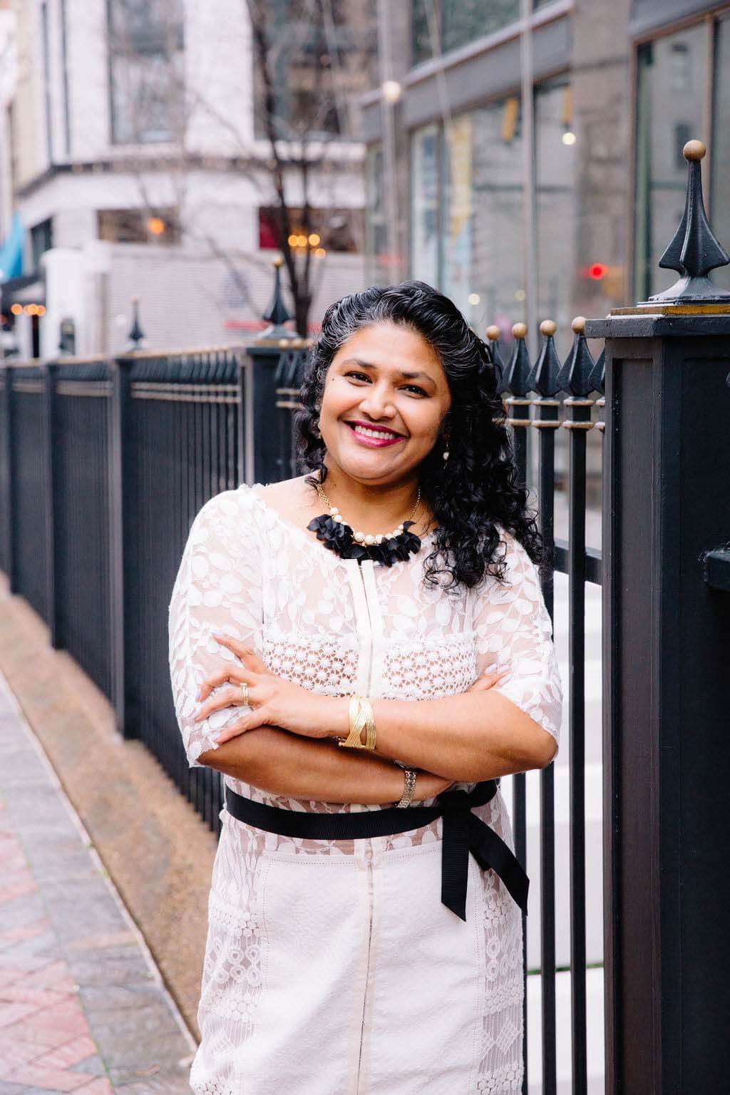 Memphis is not only Nisha's husband's hometown, but it is also where she found her adopted son. Powers Hill Design president posing in downtown Memphis.