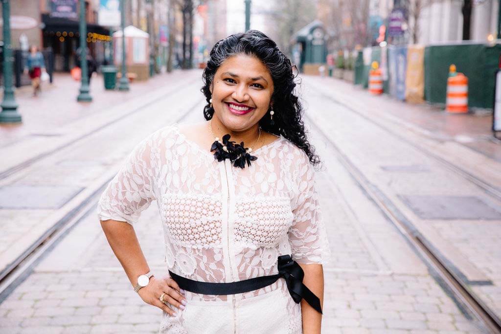 Meet our newest FACE of Memphis, co-founder and president of Powers Hill Design, Nisha Powers. Nisha Powers standing in Memphis streets