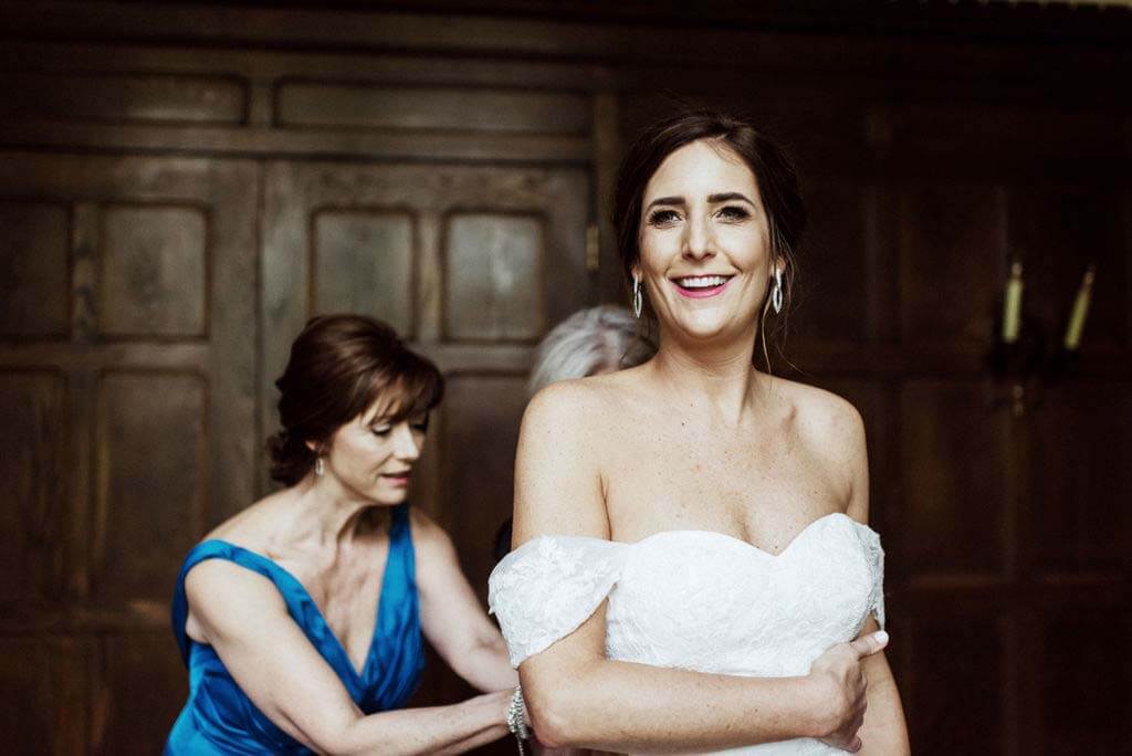 Ellen was fortunate enough to have help from both her mother and mother-in-law as she prepared for her walk down the aisle. The bride getting ready, with her mother and mother-in-law