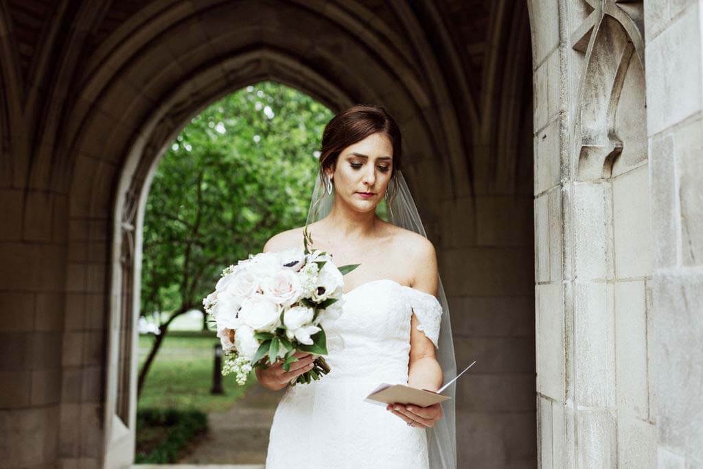 Ellen enjoys a sweet, sentimental pre-wedding moment, as she reads a card from her husband-to-be. bride reads card given to her by groom at Southern hospitality wedding