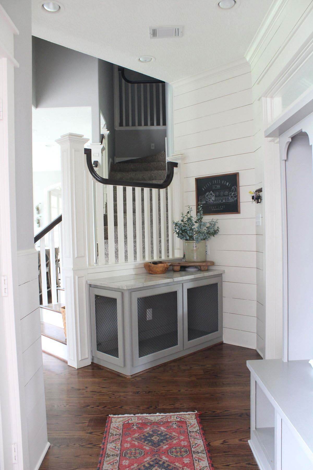 Houston Farmhouse renovation dog kennel in mudroom hallway