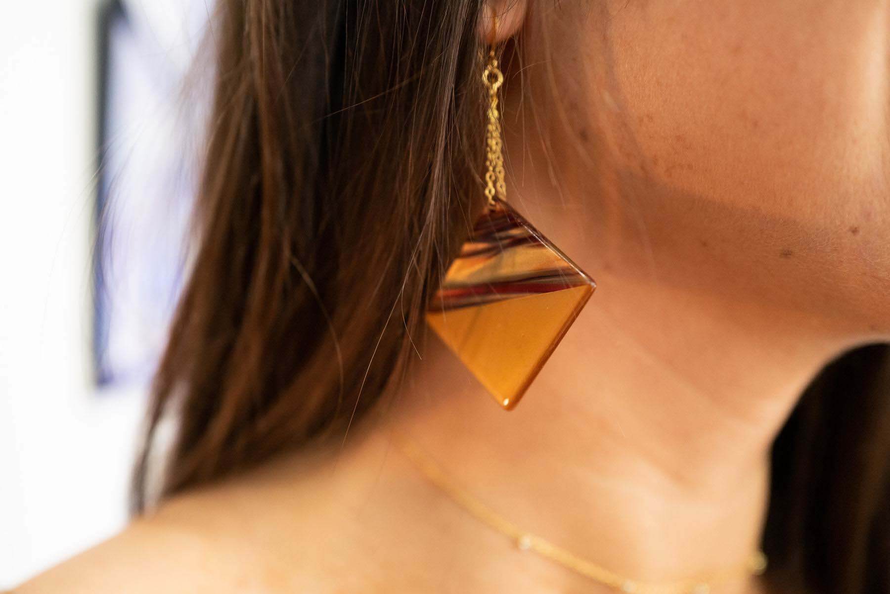 Square drop earrings close-up photo