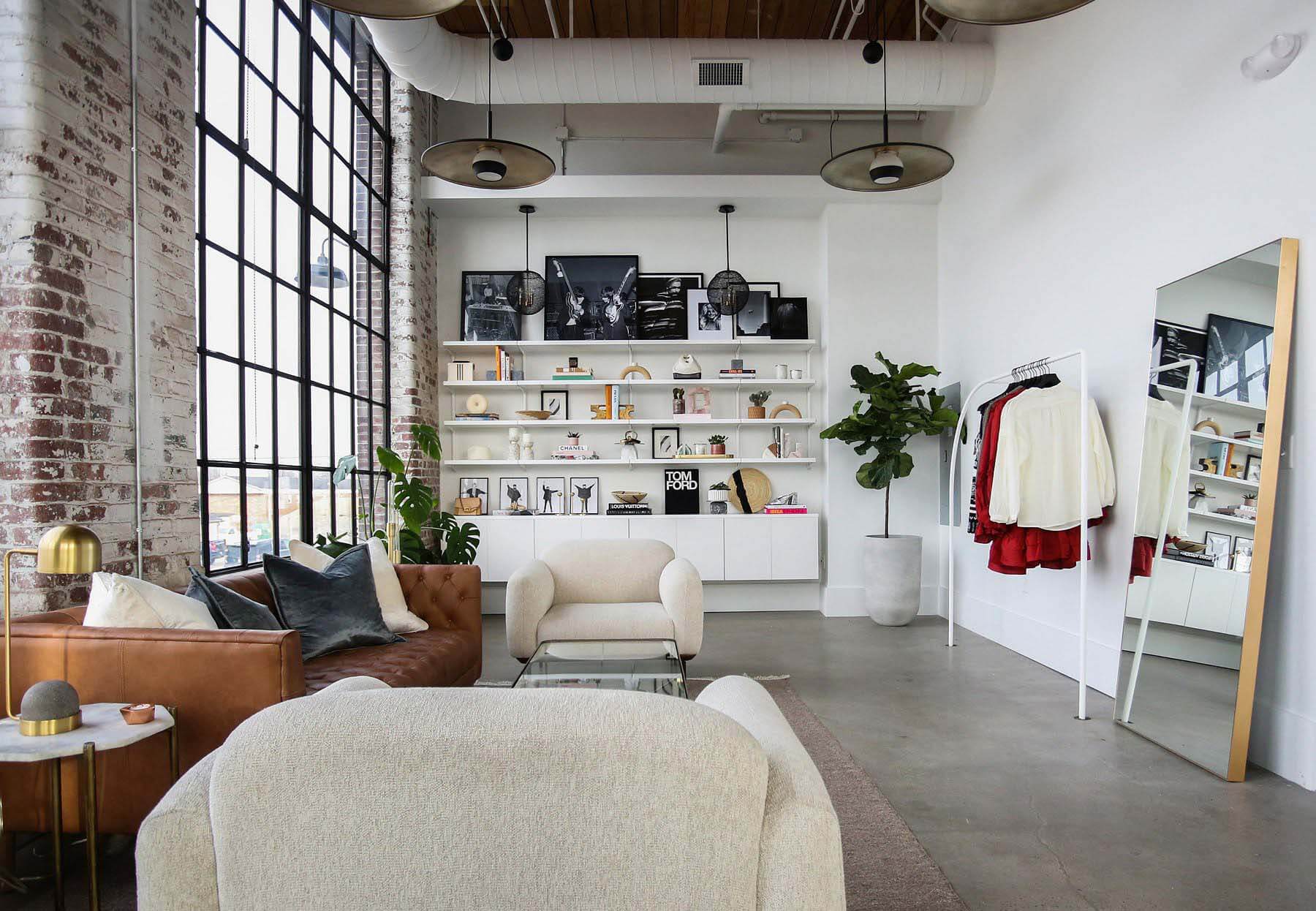 Walking into Happily Grey is like walking into Mary's closet. And what a closet it is! Interior of Happily Grey, with couches, shelving, clothing rack