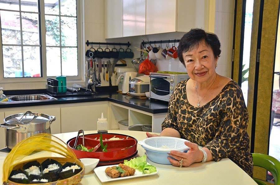 Culinary trips are a big travel trend for 2020. One way to satisfy your inner foodie is to have an authentic cooking experience by way of Traveling Spoon's local connections. Rosaline, pictured here, is a talented cook and author of three cookbooks, who you can visit while in Singapore. Image: Traveling Spoon Traveling Spoon