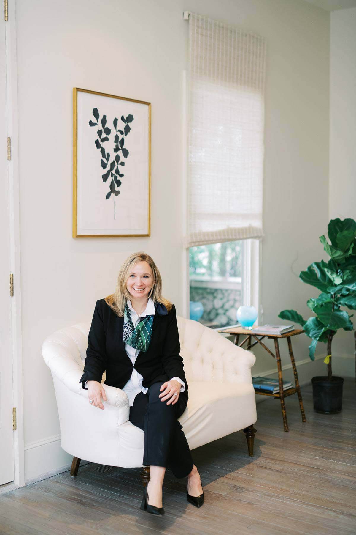 Because of the rise in dual-income families, Lauren focuses her practice on issues women want to know more about so they can reach their financial goals. Lauren Pearson posing on an all-white couch