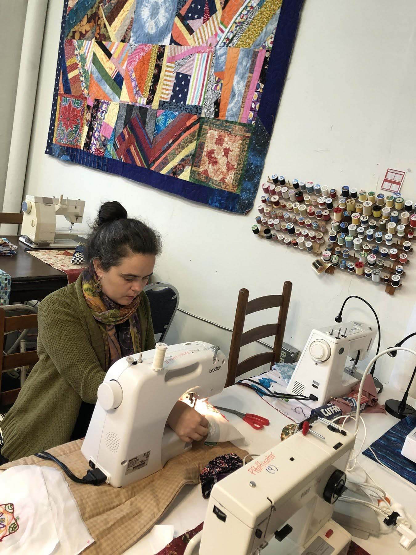 Lillis Taylor of Bib & Tucker at sewing machine