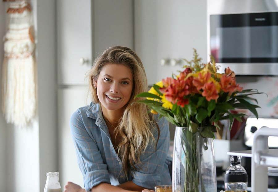 Laura Lea Bryant leaning in kitchen