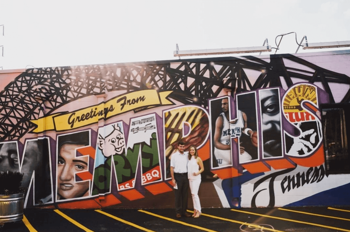 Couple posing in front of 901Mural