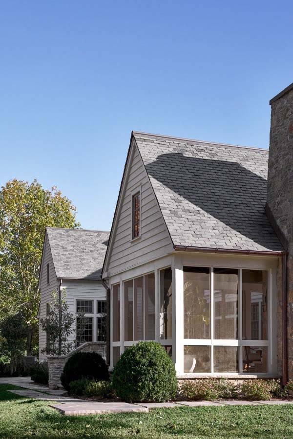 The screened porch offers views of the expansive property, including the nearby pond. Screened porch at Pfeffer Torode home on Tyne Blvd.
