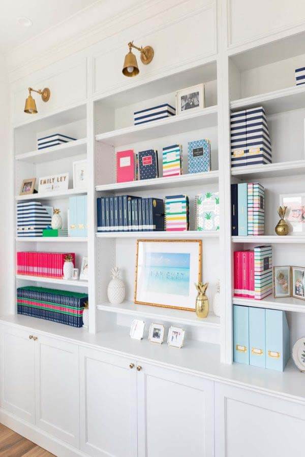 All white book shelves in Emily Ley's office