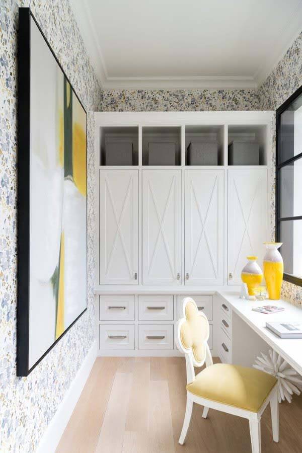 Office with all-white storage cabinets and desk