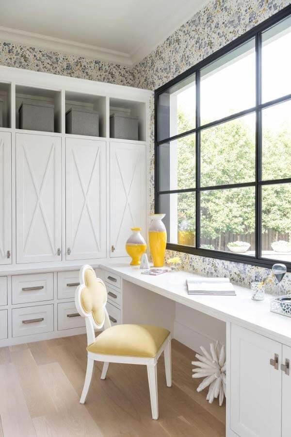 Office desk and chair overlooking yard
