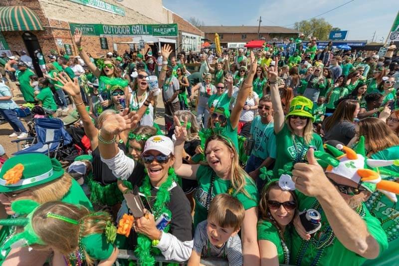 Crowd of people wearing green at parade