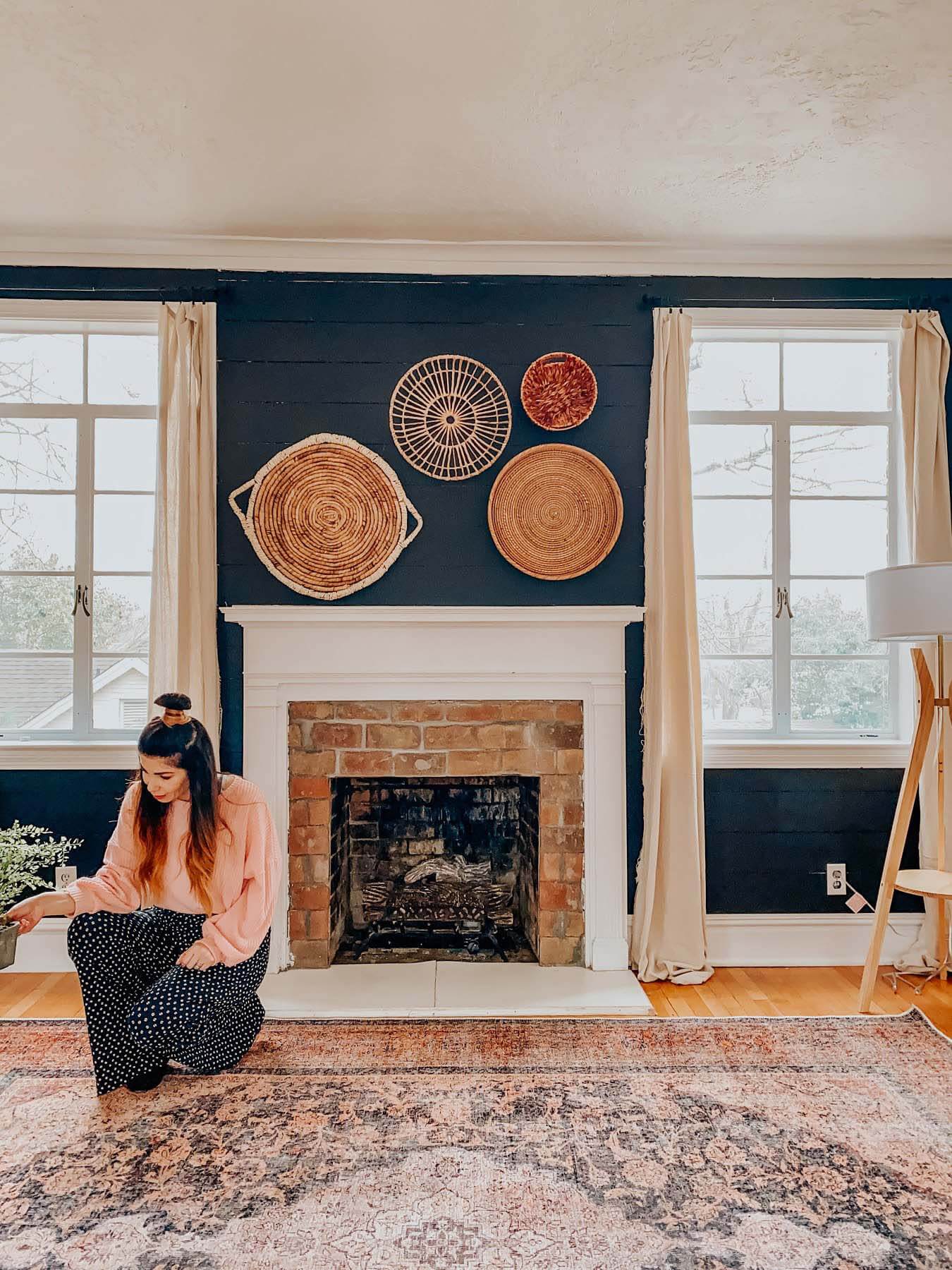 Charlotte Evans Russell posing in front of fireplace