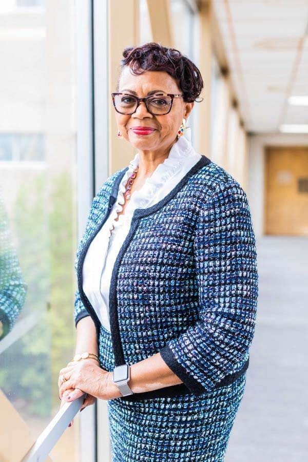 Dr. Jones tells us her favorite part of living in Memphis is the city's rich diversity and culture. Dr. Florence Jones standing next to a window