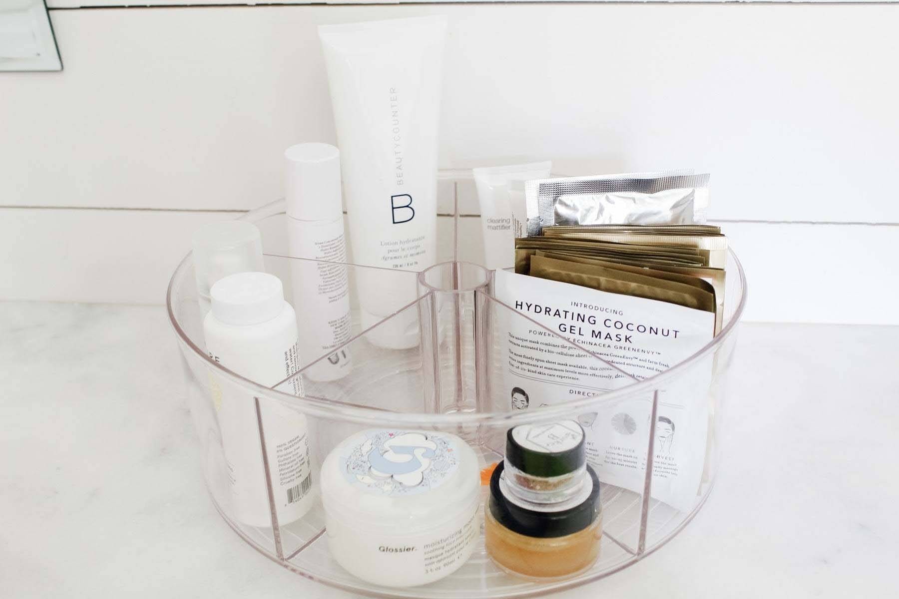 A clear organizer for your everyday items within arm’s reach is a smart way to streamline the morning rush. Image: Blue Pencil Home Beauty products is clear organizer