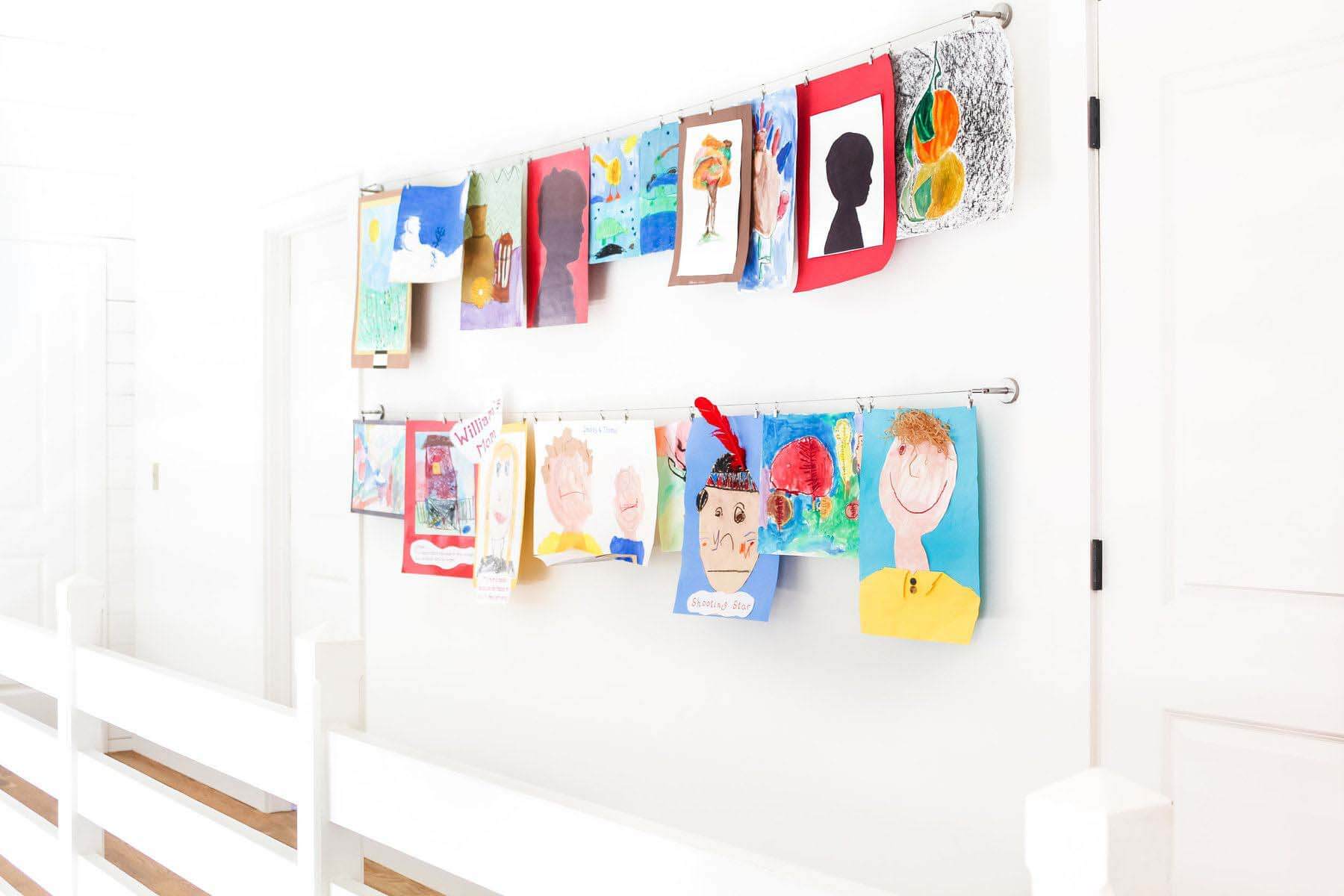 “We like to install a DIGNITET Curtain wire from Ikea to hang kids’ art. It’s perfect for when a child loves to see their work displayed, but you don’t think you will keep it forever,” says Brooke Levy of Blue Pencil Home. Image: Blue Pencil Home Children's art
