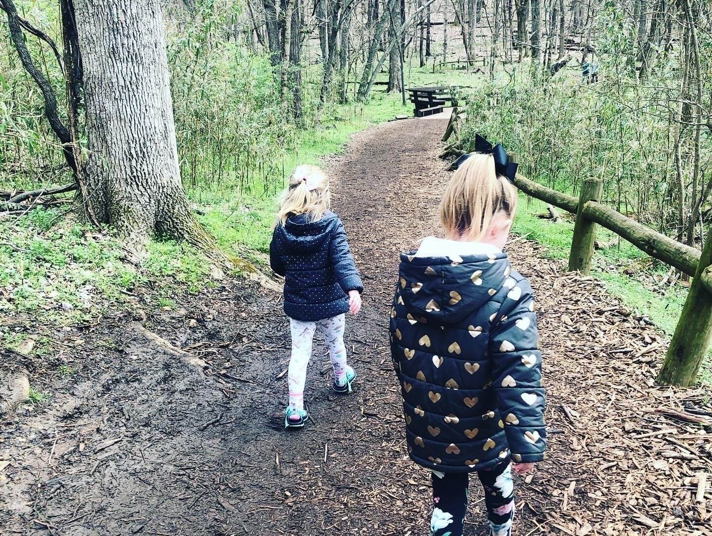 working from home with kids, my girls walking on a wooded path