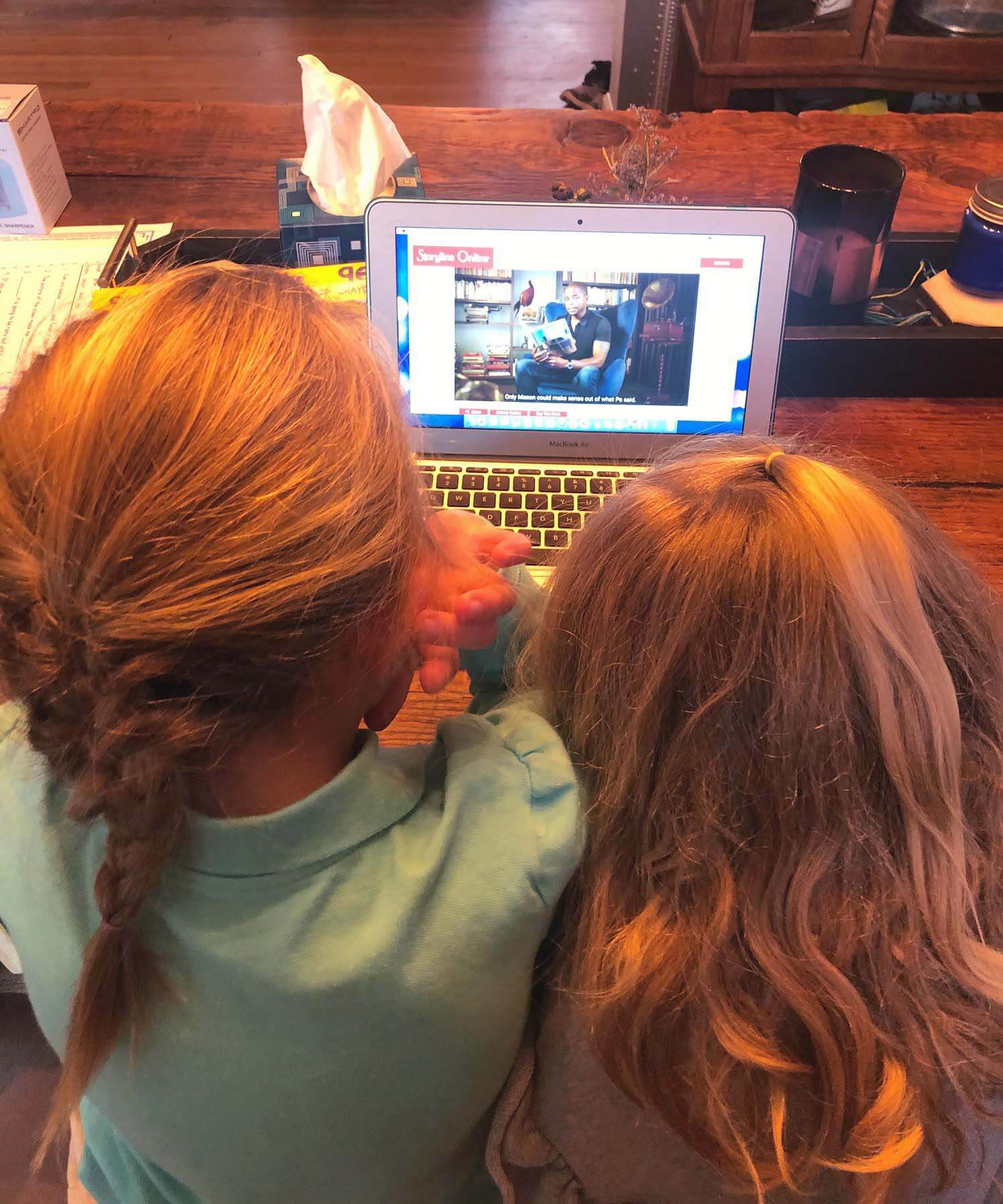 working from home with kids, my girls watching story time on computer