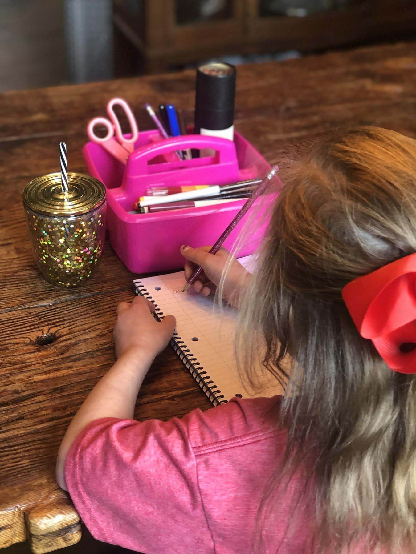 working from home with kids, my daughter writing during homeschooling