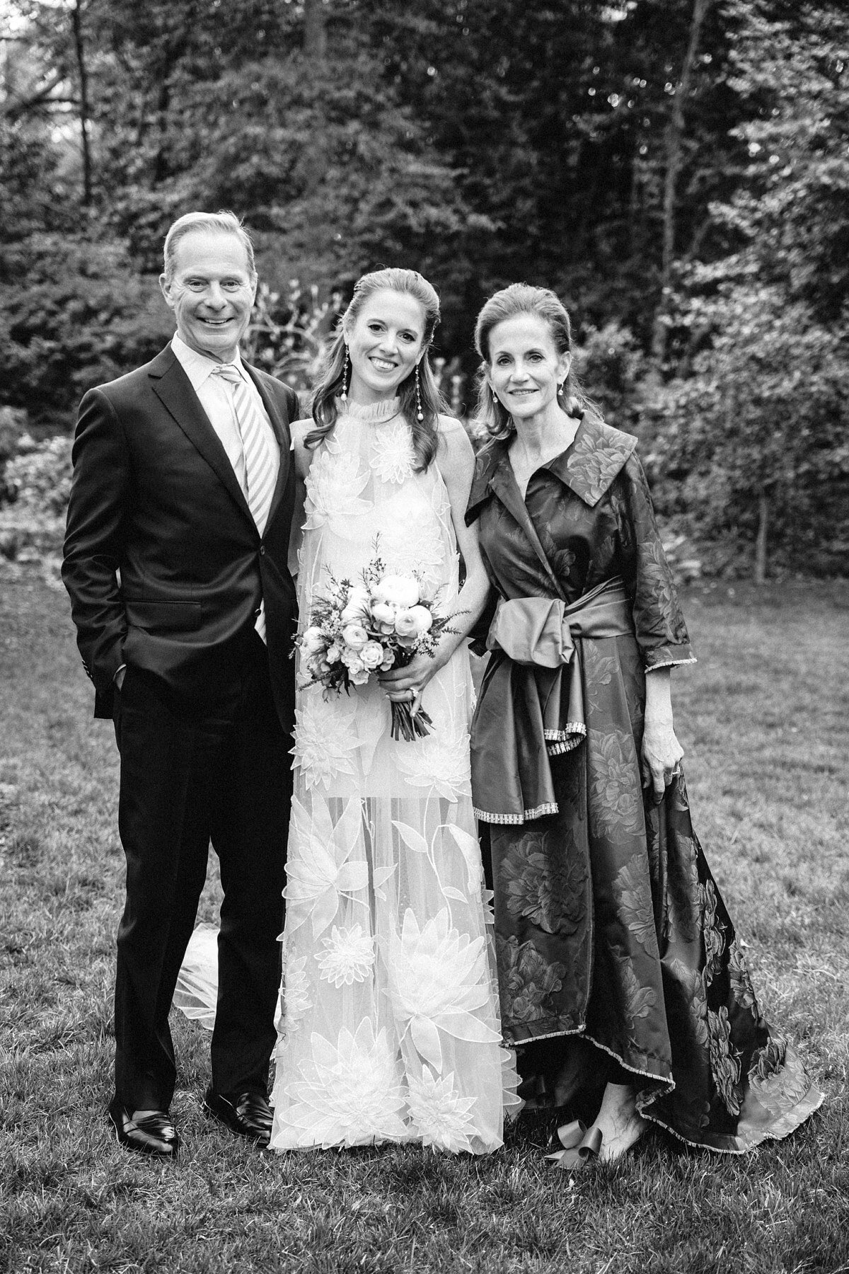 Eliza and her parents on her wedding day during the quarantine.