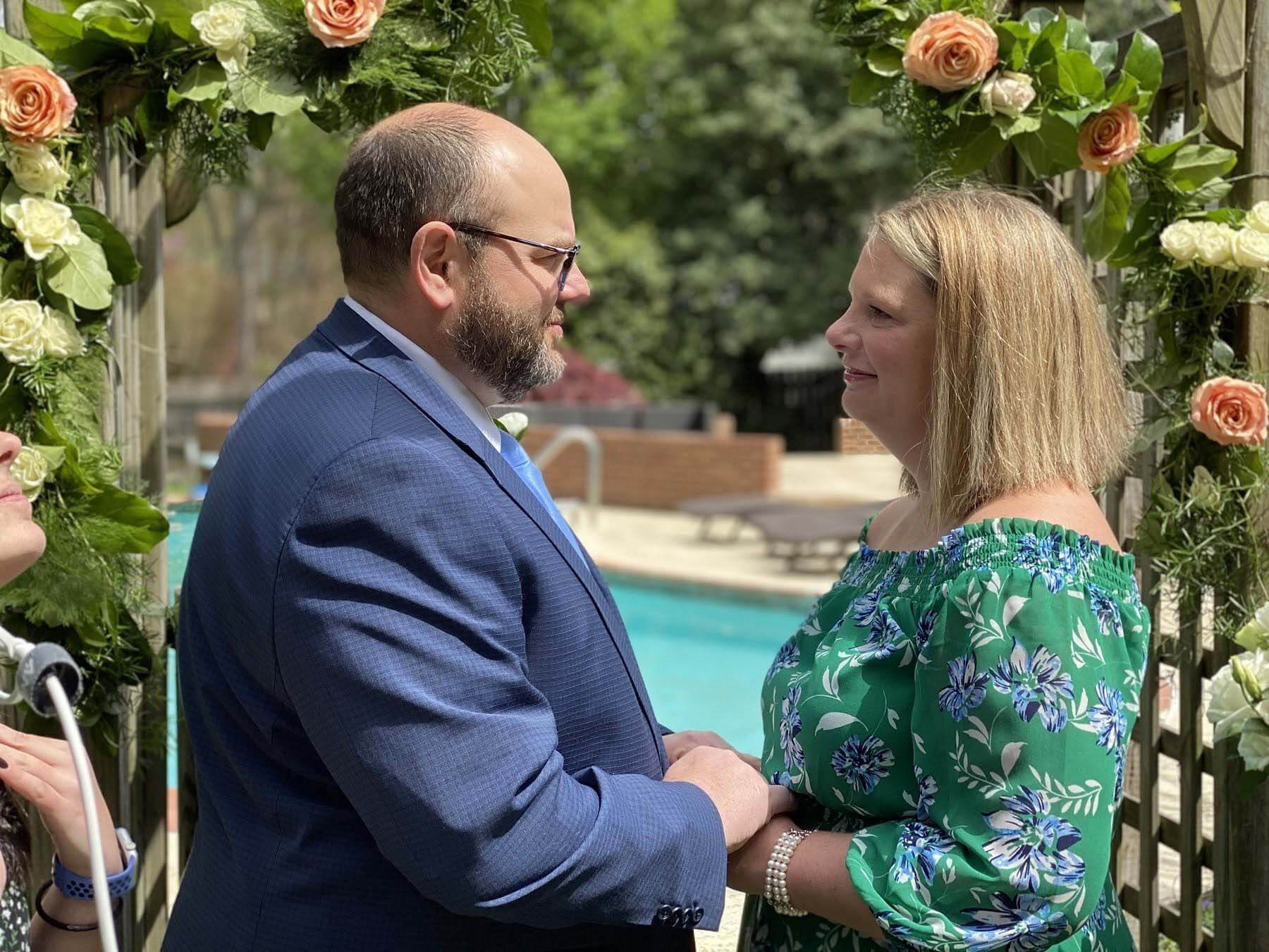 Mr. and Mrs. Clymer saying vows during quarantine wedding