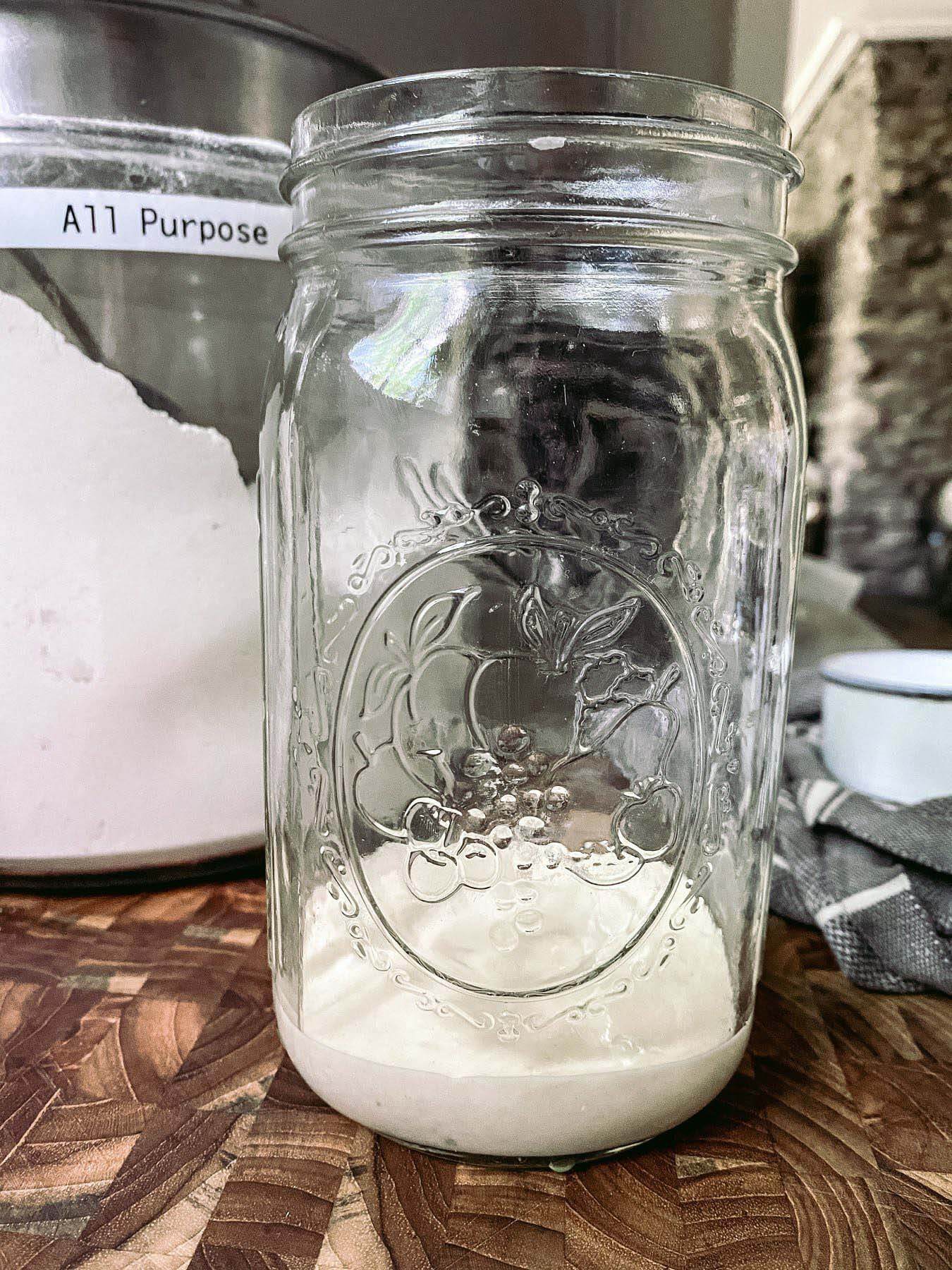 Jar with flour for sourdough starter