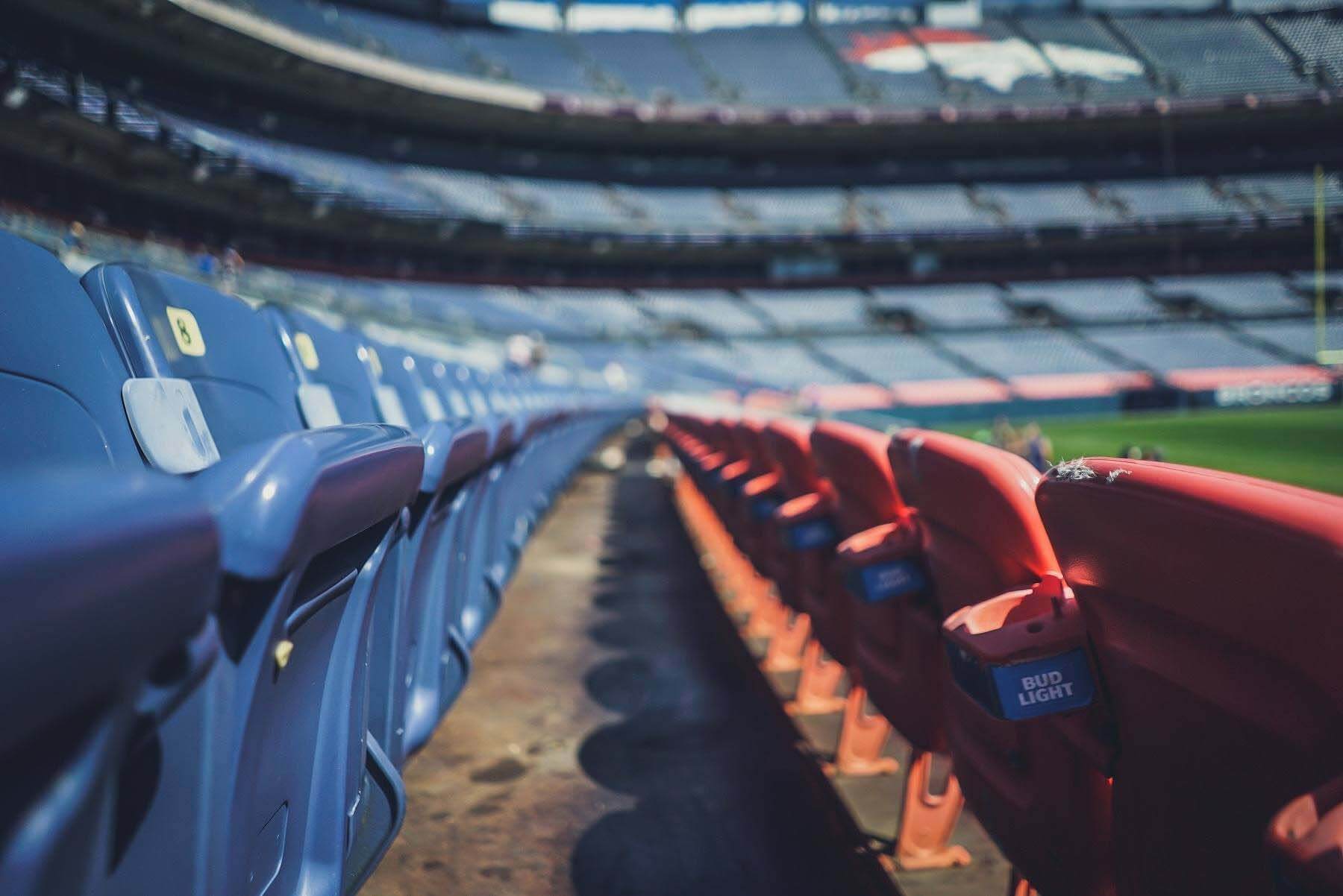 Although stadiums around the world are empty right now as sporting events are canceled for the foreseeable future, fans are finding new ways to fill their time. empty sports stadium